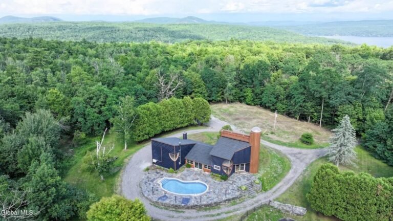 A $995K Midcentury Home Near Lake George Comes with 60 Acres and a Silo Tower