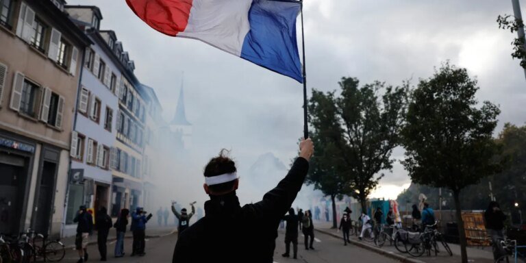 French police use tear gas and water cannons after some protests turn violent